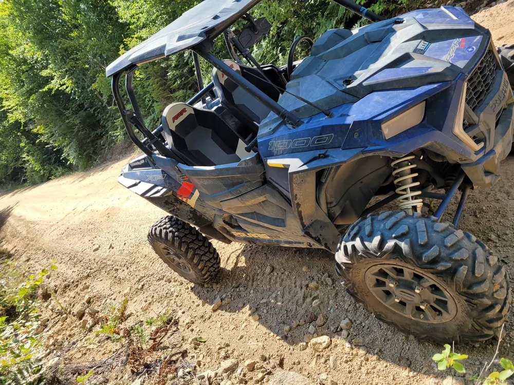 A side-by-side buggy on a wooded trail near Berlin, New Hampshire